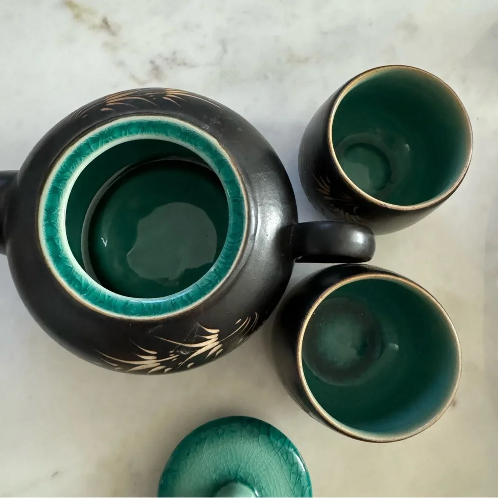 Carved Vietnamese tea kettle set with 2 small tea cups